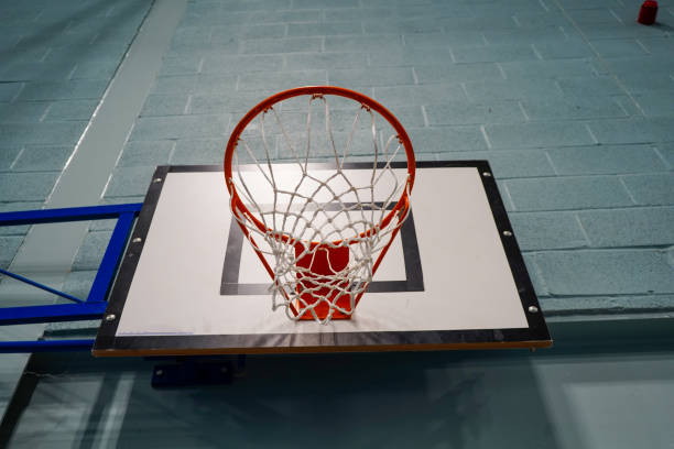 istock Looking up at a basketball hoop and backboard 1467261630