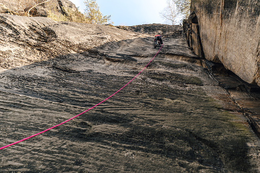 Epic sport climbing on giant sandstone cliffs of Elbe sandstone towers. Adventorous traditional Czech climbing on Sandstone.