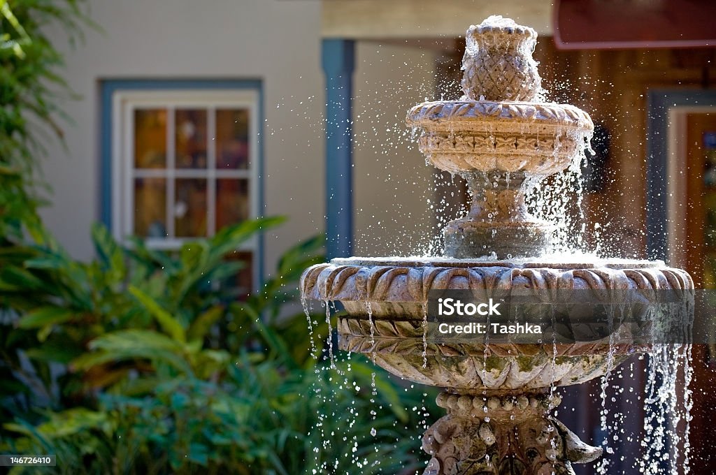 Two-tiered garden fountain flowing with water Garden fountain in St. Augustine, Florida Fountain Stock Photo