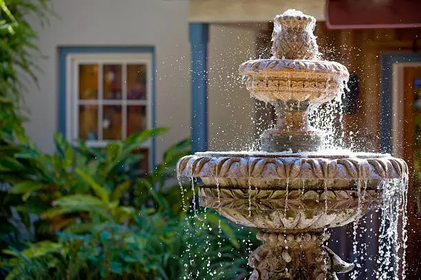 Photo of Two-tiered garden fountain flowing with water