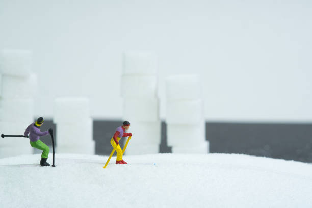 skiers in action , sugar mountains in the background