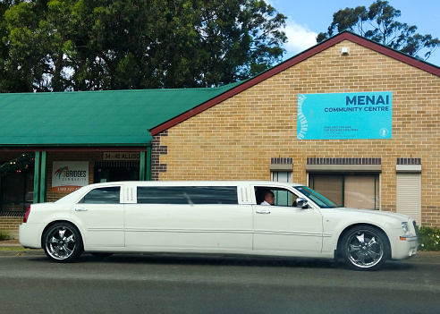 Luxury Stretch Limousine primarily white in colour, parked outside a community hall in South Sydney, NSW Australia