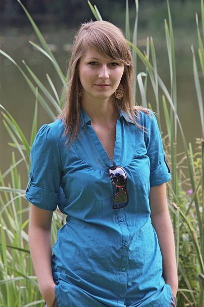 young girl in blue shirt stock photo