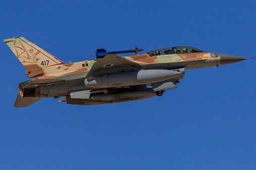 Tel Aviv, Israel – October 24, 2021: A fighter during fight in background of blue sky