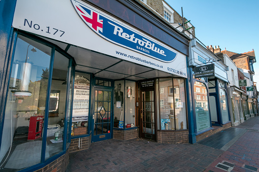 Retro Blue Barber Shop on Tonbridge High Street in Kent, England. This shop is now permanently closed.
