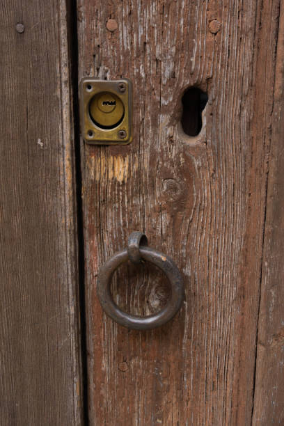 istock Wooden door with an iron ring and a bolt 1467269620