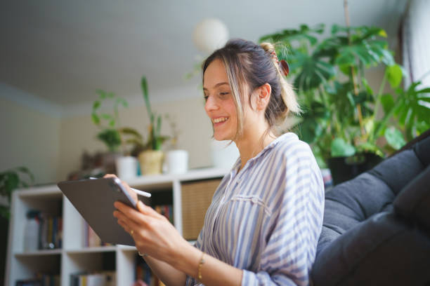 istock Woman using digital tablet and pen at home 1467271460