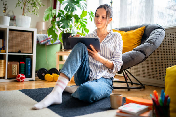 istock Woman using digital tablet and pen at home 1467272000