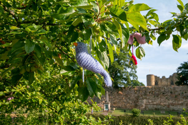Covid-19 Decorations at Tonbridge in Kent, England. These were artistic elements made by locals and placed in a public tree. Tonbridge Castle is in the background.