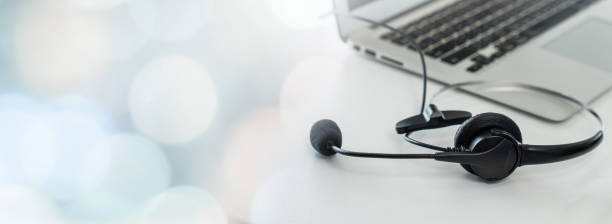 istock Headset and customer support equipment at call center ready for actively service . Corporate business help desk and telephone assistance concept . 1467275273