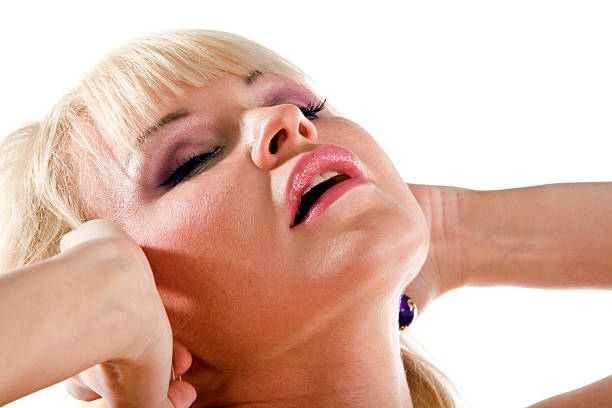 Lovely blond woman with closed eyes stock photo