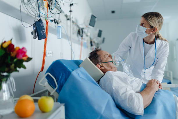 istock Young woman doctor checking elderly patient with oxygen mask. 1467280681