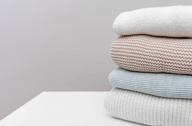 istock Warm winter sweaters are on the bedside table. 1467281072