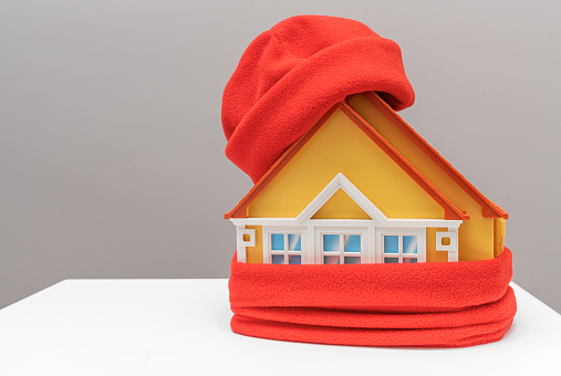 The house is wrapped in a warm scarf. Savings and heating season.