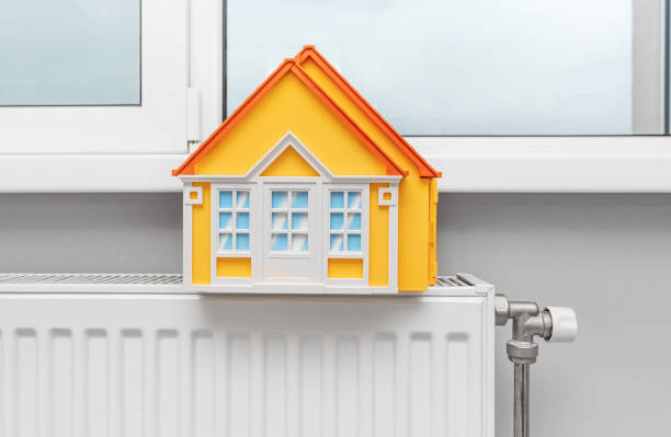 istock Model of a house on a radiator. 1467281941