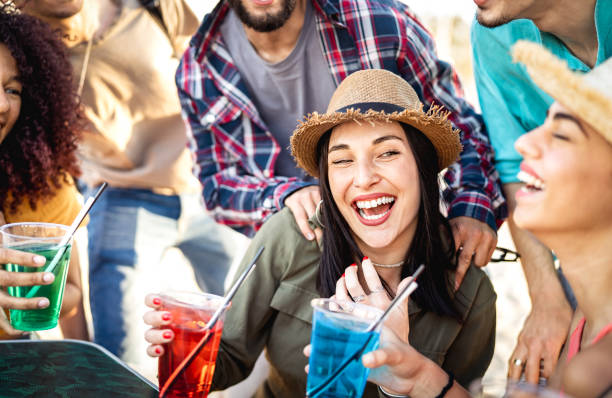 istock Young people having fun drinking at open air cocktail bar - Beverage life style concept with guys and girls enjoying time together sharing fancy drinks on happy hour at summer festival - Bright filter 1467282053