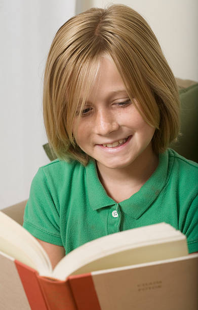 istock Girl Reading and Smiling to Herself 146728370