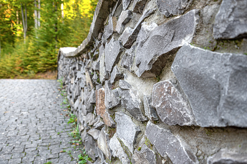 Antique stonework of the bridge. You can see the stones well.