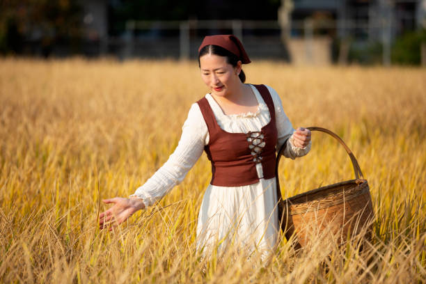 istock A female farmer in ripe rice field 1467287082