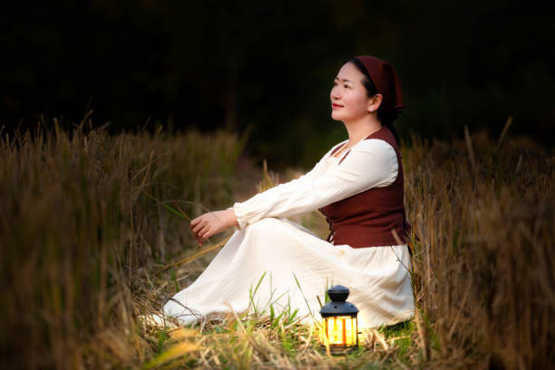 istock A lady in autumn field at dusk 1467287571