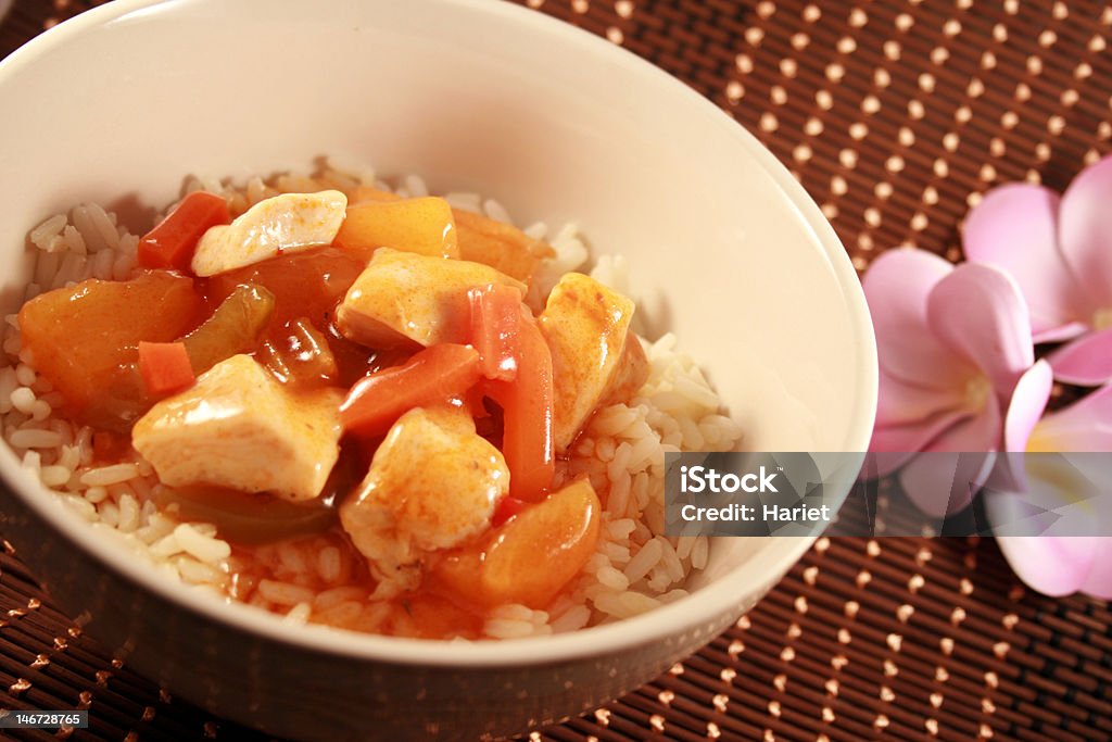 Sweet and sour chicken Sweet and sour chicken with rice served in a bowl. Bowl Stock Photo