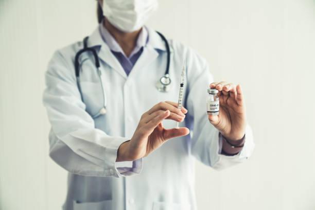istock Skillful doctor prepare vaccine proficiently before injection . Covid 19 and coronavirus vaccination center service concept . 1467287803