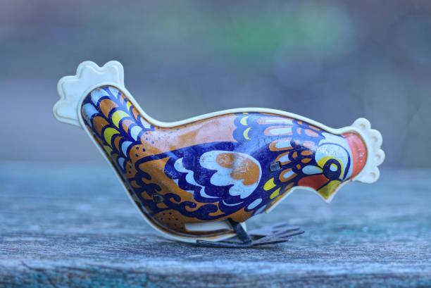 istock one small colored metal mechanical rooster toy 1467287866