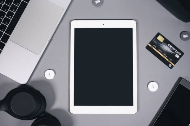istock Mock up blank screen digital tablet for copy space top view office table with gadget 1467288055