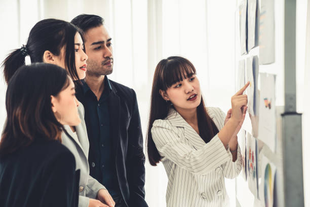 istock Business people proficiently discuss work project while sitting in circle . Corporate business team collaboration concept . 1467288195