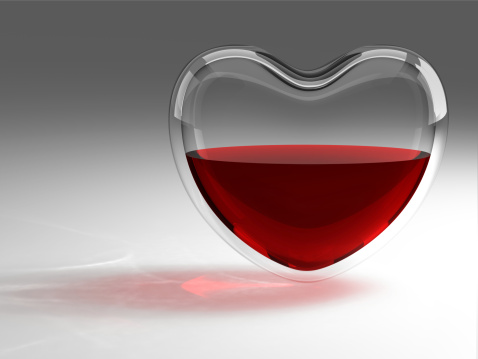 Glass heart with red wine
