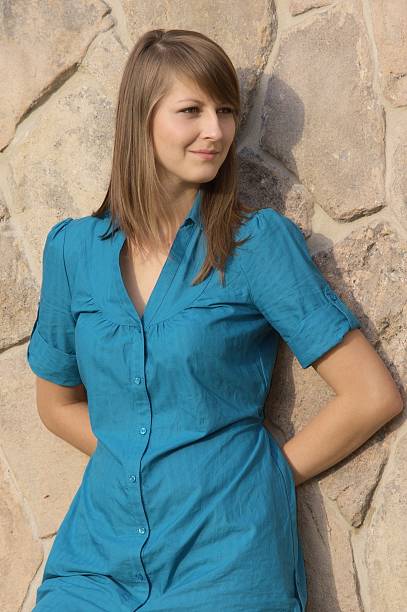 young girl in blue shirt stock photo