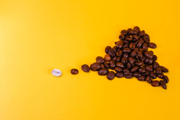 istock coffee beans are black and one bean is white, different from all 1467290912