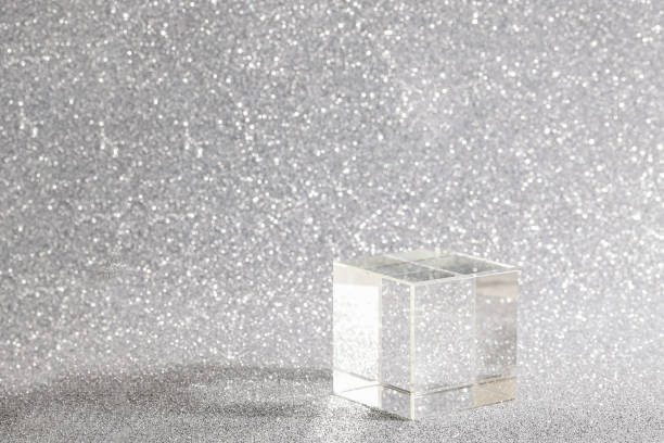 istock transparent podium for product display on silver glittering background. pedestal, stage for product. copy space. selective focus 1467293201