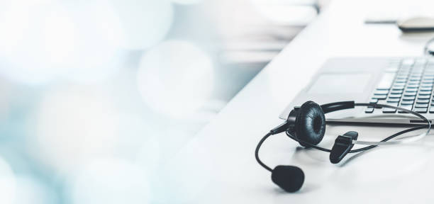 istock Headset and customer support equipment at call center ready for actively service . Corporate business help desk and telephone assistance concept . 1467293282