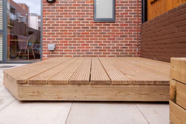 istock Newly built wooden deck in back garden. 1467293532