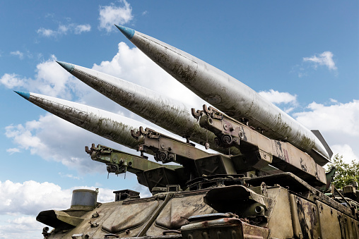 Surface-to-air missiles with radar guidance system pointing to the sky.