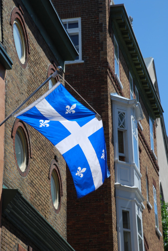 Fleur-de-lys flag of the province of Quebec, flying on a house in the old walled section of Quebec City, marking its 400th anniversary in 2008.