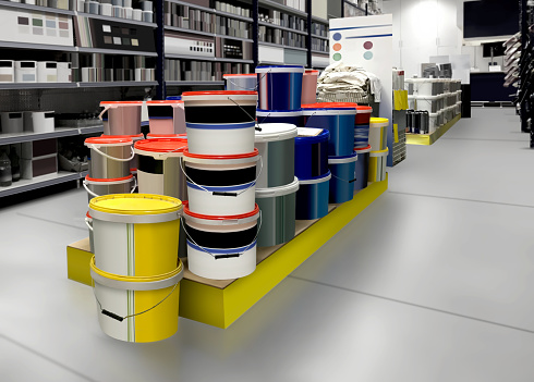 HOME PAINT Buckets and Cans white and color paint in paint shop. Mockup and 3D illustration, is suitable for presenting packagings and new design among many others