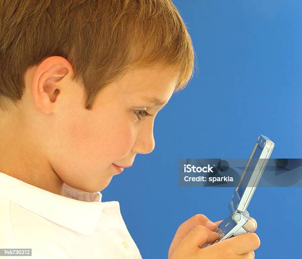 Boy With Video Game Stock Photo - Download Image Now - Activity, Arts Culture and Entertainment, Blue