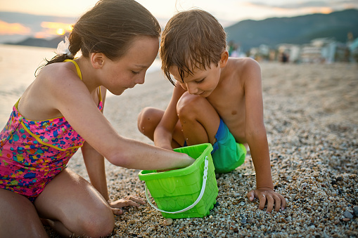 Portrait of wet kids enjoying a beach holiday