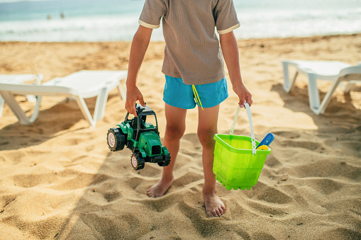 Little boy with sand toys