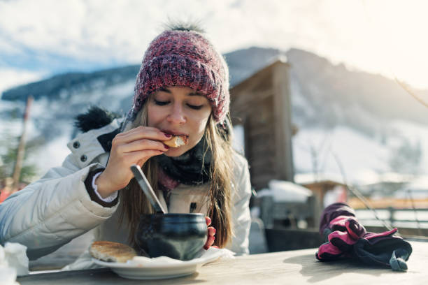 Teenage girl enjoying hot goulash soup in an outdoors restaurant on a sunny winter day. Teenage kids in outdoors apres-ski restaurant having lunch. Teenage girl enjoying hot goulash soup in an outdoors restaurant on a sunny winter day.
Canon R5 apres ski stock pictures, royalty-free photos & images