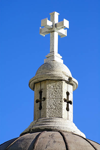 Architectural detail: Cross on cupola stock photo
