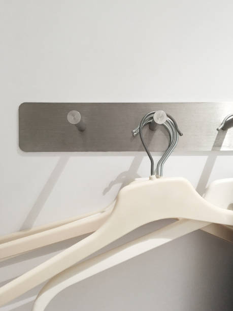 istock Clothes hanger hanging in clothing store dressing room 1467314138