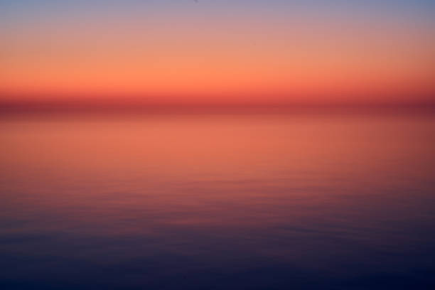 istock Abstract sunset over the sea with blue hour clouds 1467314472