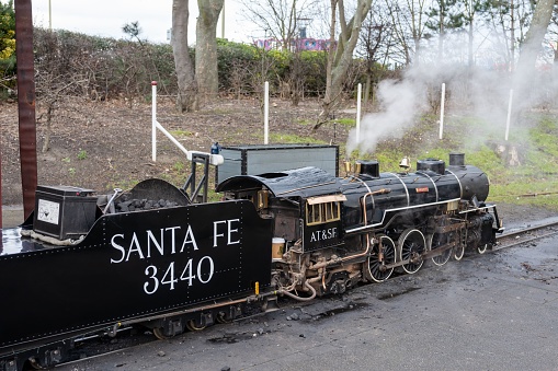 South Shields, United Kingdom – January 28, 2023: The Santa Fe narrow gauge steam train engine in Marine Park in the town of South Shields, UK.