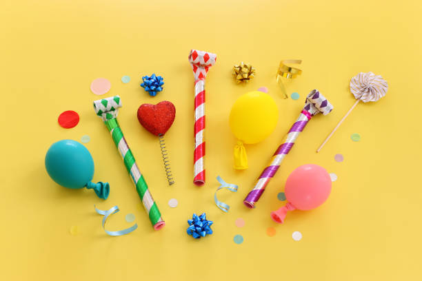 istock Top view image of party and present objects on yellow background 1467318315
