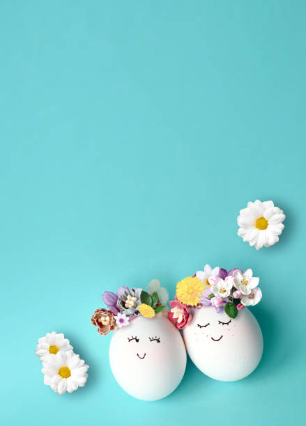 istock Funny Easter Eggs, hand drawn faces. Easter holiday concept with cute handmade eggs in floral wreath crowns. 1467318873