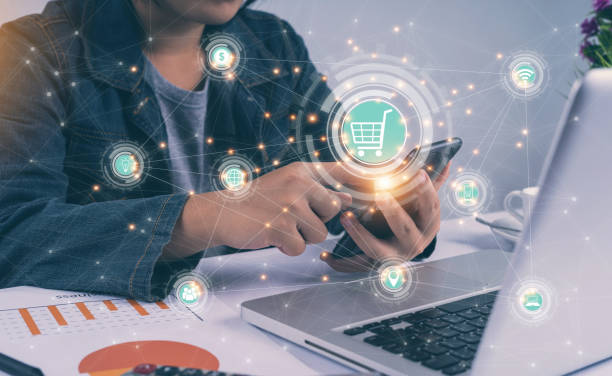 istock People hands using smartphone and laptop with online banking network icon screen. Online payment digital and shopping online. marketing, financial. Global internet network connection technology. 1467319071