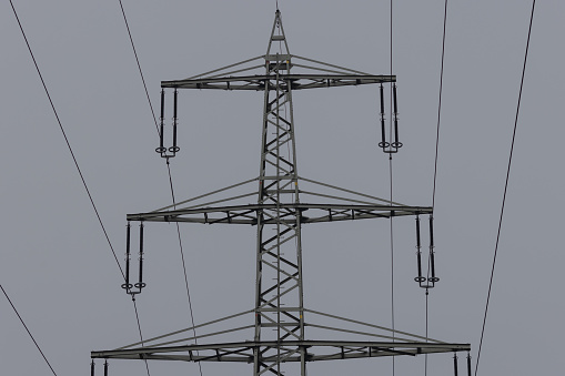 image of an electricity pylon on a bright cloudy day in Germany